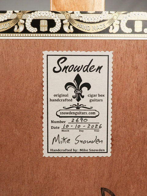 Back view of a 3 string cigar box guitar made with a Queen B Fuente cigar box. This cigar box guitar is handmade by Mike Snowden of Snowden Guitars.