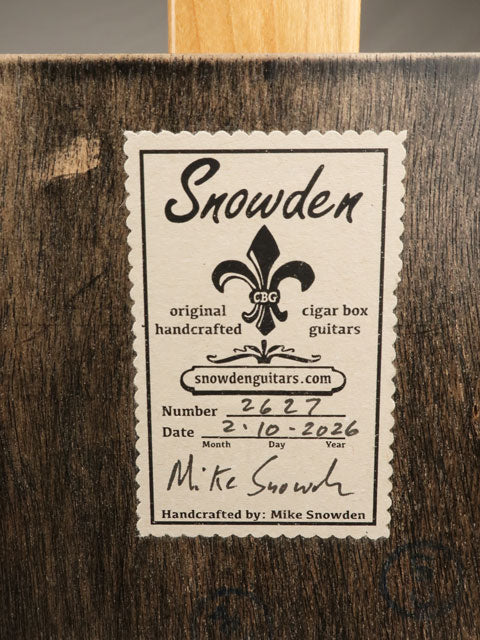 Back view of Snowden cigar box guitar label on a wooden cigar box guitar made by Mike Snowden.