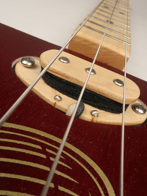 Close up view of a cigar box guitar 3 string single coil pickup. Handmade by Mike Snowden.