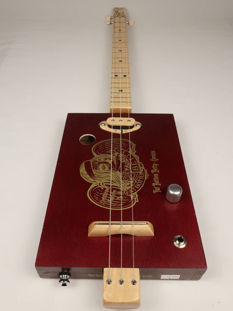 Cigar Box Guitar front view red Fat Bottom Betty 3 String. Handmade by Mike snowden with a single coil pickup.