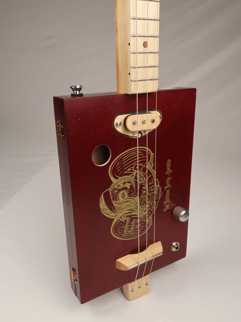 Front side view of a 3 string cigar box guitar. Maple single coil pickup handmade by Mike Snowden.