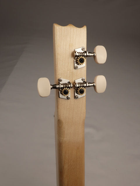 Back view of a cigar box guitar headstock. 3 string with a maple neck handmade by Mike Snowden.