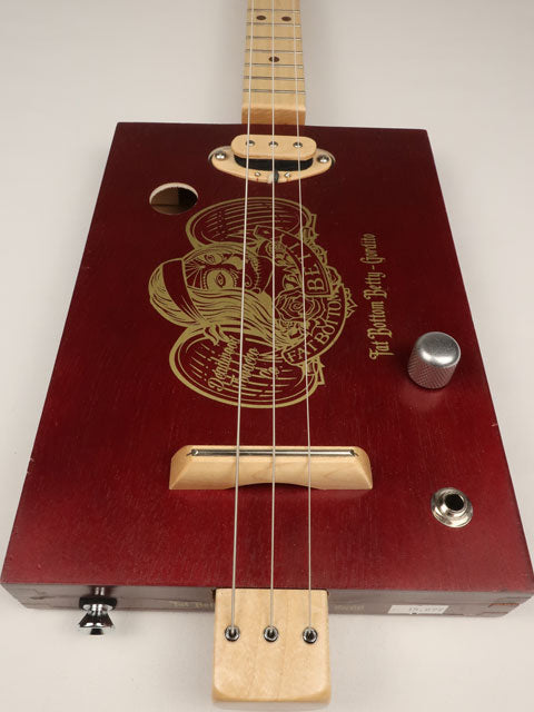 Front view of 3 string cigar box guitar Fat Bottom Betty. Handmade by Mike Snowden with a single coil Pickup.