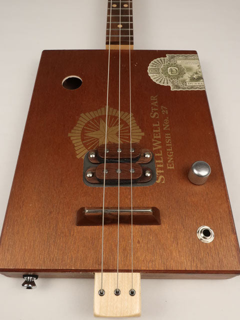 Front view cigar box guitar stillwell star 3 string. This cigar box guitar is handmade by Mike Snowden.