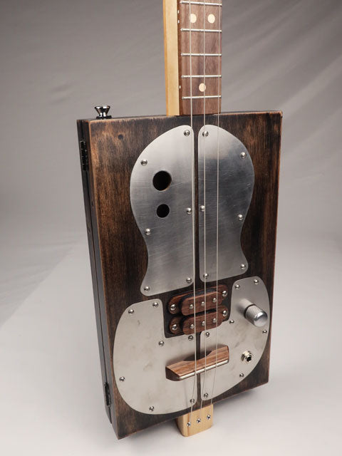 Metal Top 3 String Cigar Box Guitar CBG #2627 front view tiled to the side made by Mike Snowden. 