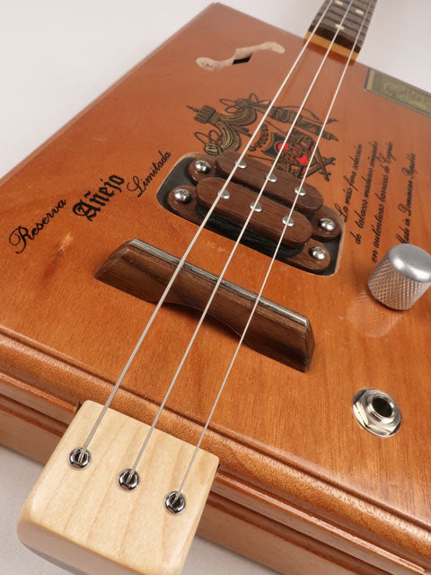 Front tilted view of a 3 string cigar box guitar A-Fuente handmade by Mike Snowden of Snowden Guitars.