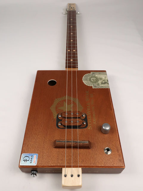 Front view of a 3 string cigar box guitar made with a StillWell Star cigar box. This cigar box guitar is made with a sapele fretboard and maple inlay by Mike Snowden of Snowden Guitars.