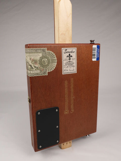 Back view of a 3 string cigar box guitar made with a StillWell Star cigar box. This cigar box guitar is made with a sapele fretboard and maple inlay by Mike Snowden of Snowden Guitars.