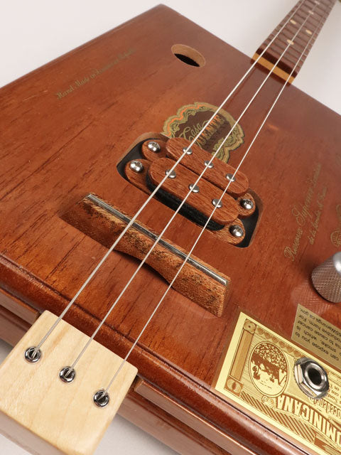 Front tilted view of a Fuente 3 string cigar box guitar made with a maple neck sapele fretboard handmade by Mike Snowden of Snowden Guitars.