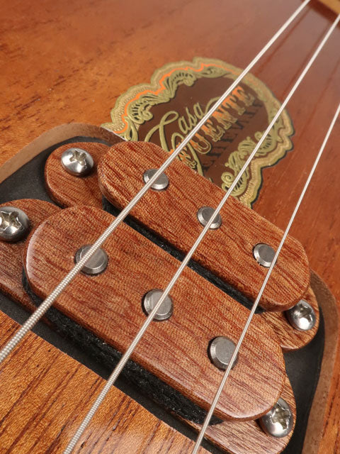 Close up view of a humbucker on a Fuente 3 string cigar box guitar made with a maple neck sapele fretboard handmade by Mike Snowden of Snowden Guitars.