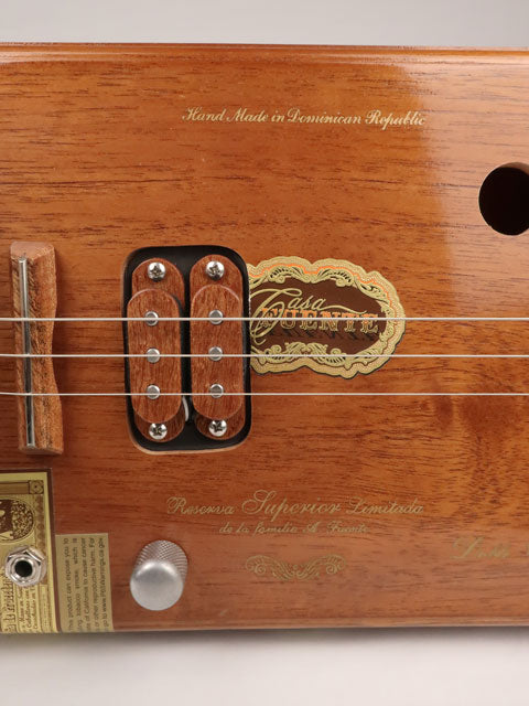 Close up view of a humbucker on a Fuente 3 string cigar box guitar made with a maple neck sapele fretboard handmade by Mike Snowden of Snowden Guitars.