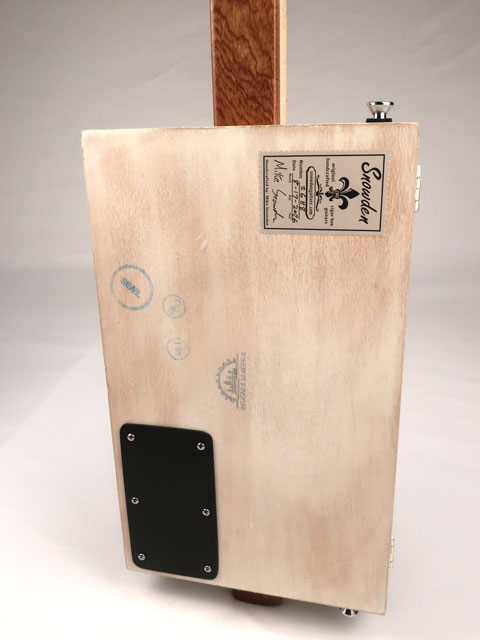 Back view of a 3 string cigar box guitar made with a humbucker pickup and copper pick guard. This cigar box guitar is handmade by Mike Snowden of Snowden Guitars.