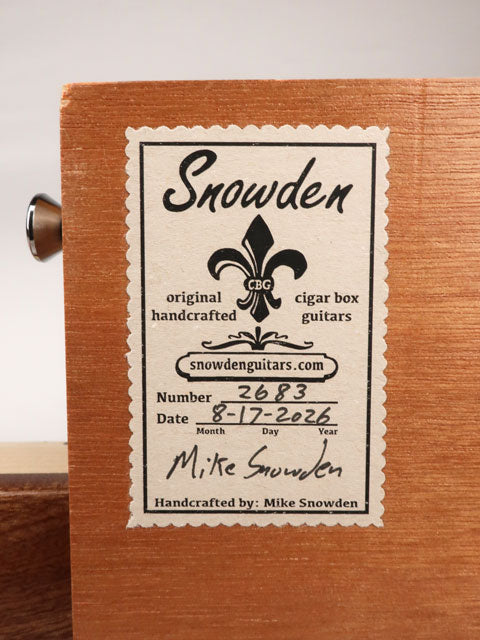 Back label view of a cigar box guitar handmade by Mike Snowden of Snowden Guitars.