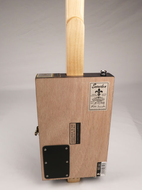Back view of a 3 string cigar box guitar made with a Pura Raza cigar box. This cigar box guitar is made with walnut and maple with a single coil pickup by Mike Snowden of Snowden Guitars.
