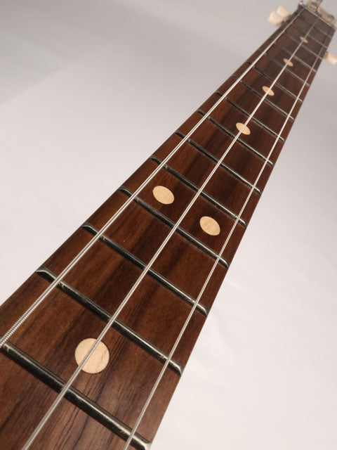 Front view of a 3 string cigar box guitar neck and fret board handmade by Mike Snowden of Snowden Guitars.