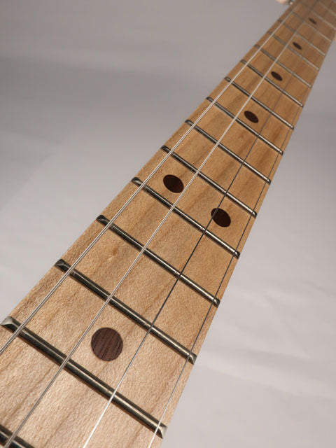 Front view of a 4 string cigar box guitar neck and fretboard made with maple neck and walnut inlay. This cigar box guitar is handmade by Mike Snowden of Snowden Guitars.