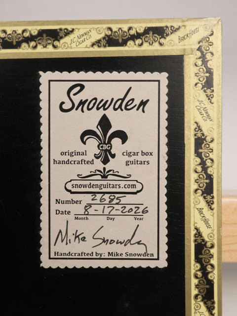 Back view of a cigar box guitar sticker on the back with Snowden Guitars logo printed on. 