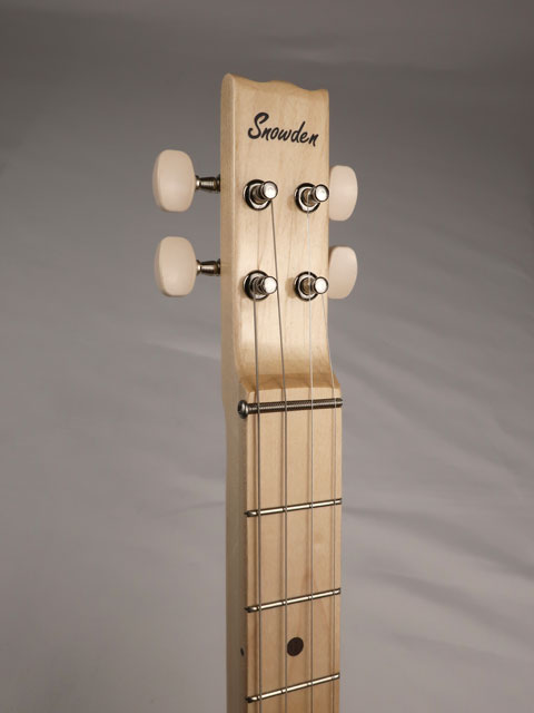 Front view of a 4 string cigar box guitar with Snowden Guitars logo on the headstock.