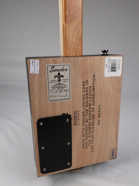 Back view of a cigar box guitar with a Snowden Guitars sticker. Maple neck with a cherry heel made by Mike Snowden of Snowden Guitars.