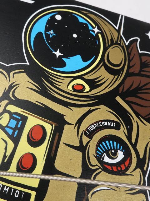 Close up view of a Johnny Tobacconaut cigar box guitar.