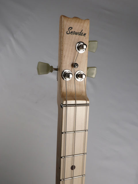 Front view of a cigar box guitar headstock with a Snowden Guitars logo on the front. This maple neck and maple fretboard and Grover Tuners is handmade by Mike Snowden of Snowden Guitars.
