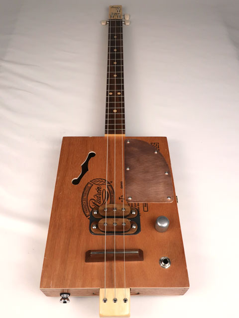 Front view of a 3 string cigar box guitar made with a Padron cigar box. Handmade by Mike Snowden of Snowden Guitars.