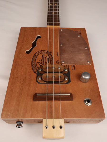Front view of a 3 string cigar box guitar made with a Padron cigar box. Handmade by Mike Snowden of Snowden Guitars.