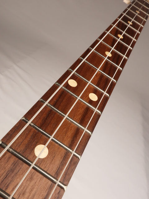 Front view of a 3 string cigar box guitar neck with a walnut fretboard. Handmade by Mike Snowden of Snowden Guitars.