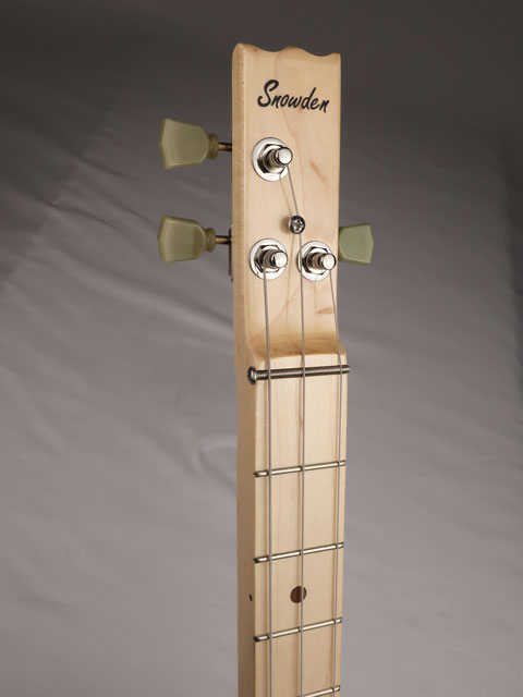 Front view of a 3 string cigar box guitar with a Snowden Guitars logo on the headstock. 