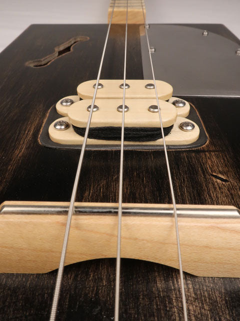 Front close up view of a 3 string cigar box guitar with a humbucker pickup. Handmade by Mike Snowden of Snowden Guitars.