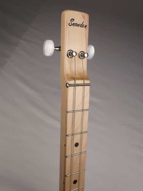 Front tilted view of a 2 string cigar box guitar with a maple neck. Handmade by Mike Snowden with a Snowden Guitars logo on the headstock.