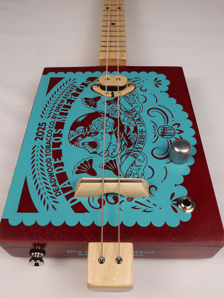 Front view of a 2 string cigar box guitar made with a Sweet Jane cigar box. Handmade by Mike Snowden of Snowden Guitars.
