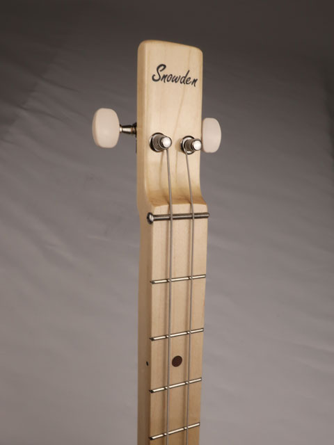 Front view of a cigar box guitar neck with a Snowden Guitars logo on the headstock. Handmade by Mike Snowden of Snowden Guitars.