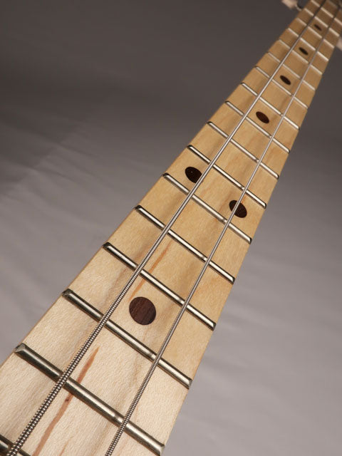 Front tilted view of a 2 string cigar box guitar neck with 2 strings. Handmade by Mike Snowden of Snowden Guitars.