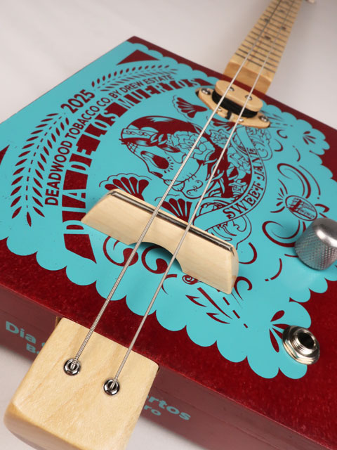 Close up front view of a 2 string cigar box guitar made with a Sweet Jane cigar box. Handmade by Mike Snowden of Snowden Guitars.