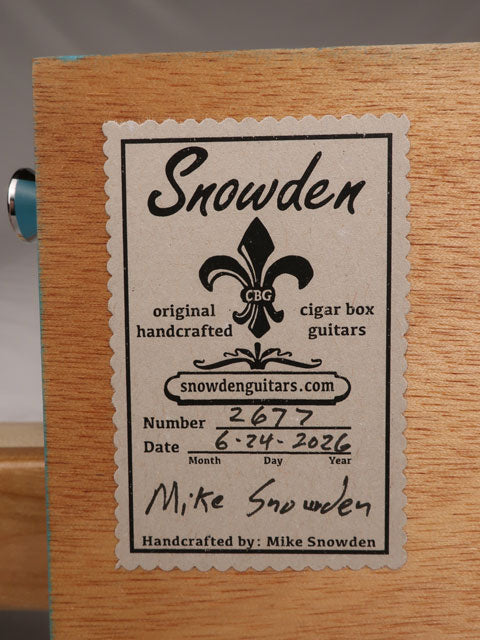 Close up back view of a 2 string cigar box guitar tag made with an AVO cigar box. Handmade by Mike Snowden of Snowden Guitars.