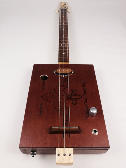 Front view of a 3 string cigar box guitar handmade by Mike Snowden of Snowden Guitars. This CBG is made with a New Orleans Cigar Factory cigar box.