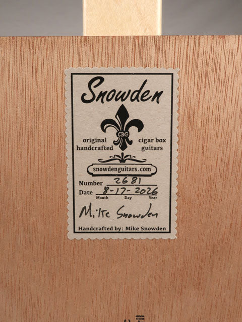 Back lable view of a 3 string cigar box guitar handmade by Mike Snowden of Snowden Guitars. This CBG is made with a New Orleans Cigar Factory cigar box.
