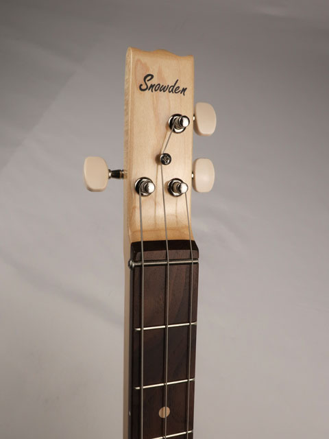 Front view of a 3 string cigar box guitar with Snowden Guitars logo on the the front headstock handmade by Mike Snowden of Snowden Guitars.
