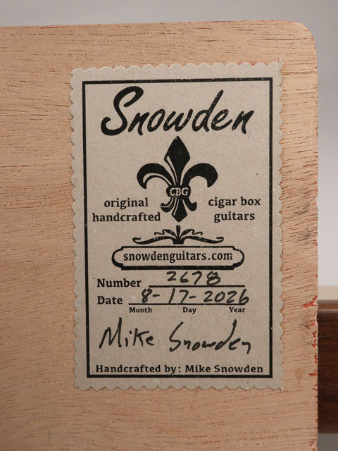Close up view of the back label of a 3 string cigar box guitar handmade by Mike Snowden of Snowden Guitars CBG.