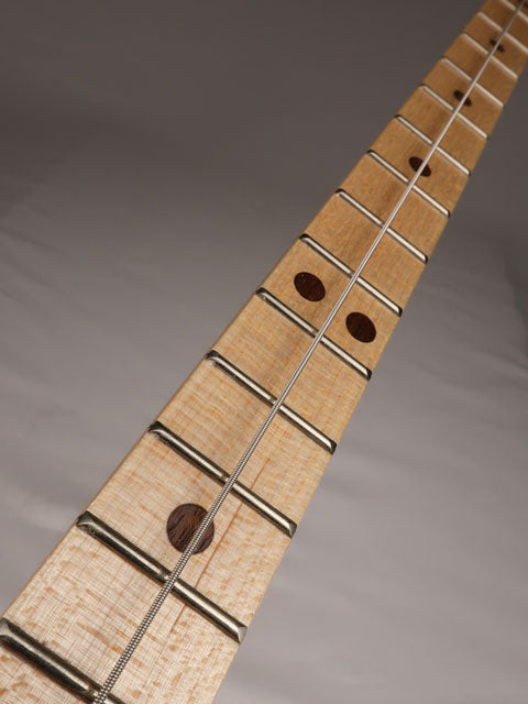 Front view of a one string cigar box guitar neck with one string. Handmade by Mike Snowden of Snowden Guitars.
