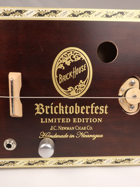Close up front view of a one string diddly bow cigar box guitar cbg made with a Bricktoberfest cigar box. Handmade by Mike Snowden of Snowden Guitars.