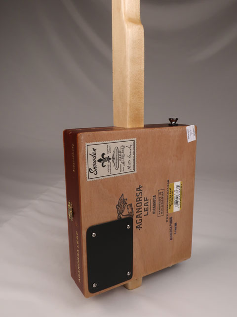 Back view of a single string diddly bow cigar box guitar made with a Aganorsa Leaf cigar box. Handmade by Mike Snowden of Snowden Guitars.