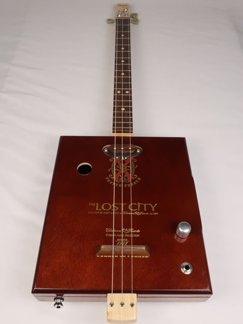 Front view of a 3 string cigar box guitar made with a Lost City Cigar box. Handmade by Mike Snowden of Snowden Guitars.