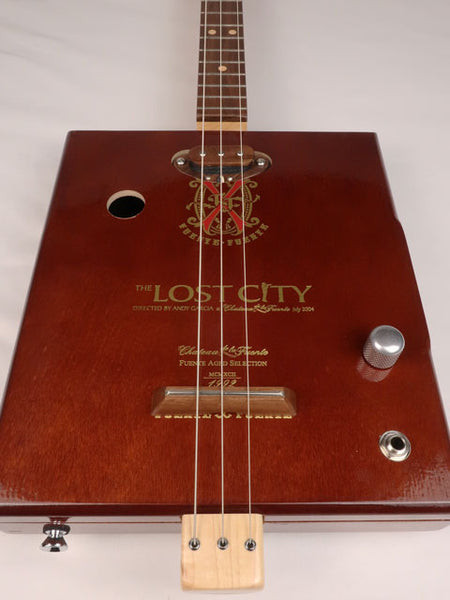 Front view of a 3 string cigar box guitar made with a Lost City Cigar box. Handmade by Mike Snowden of Snowden Guitars.
