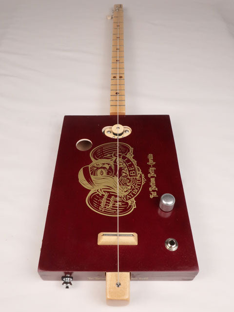 Front view of a one string diddly bow cigar box guitar made with a Fat Bottom Betty cigar box. Handmade by Mike Snowden of Snowden Guitars.