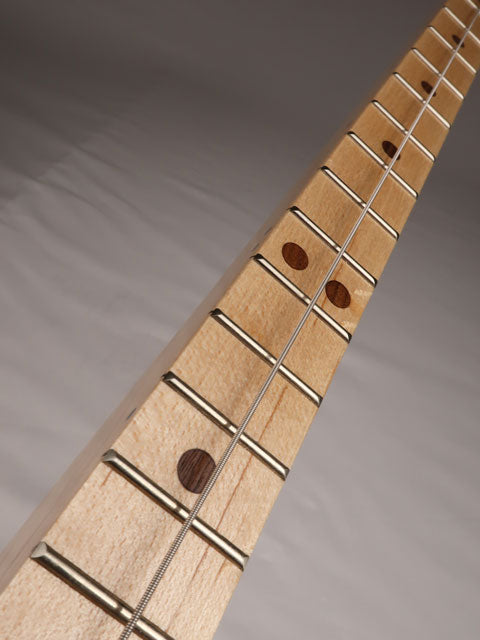 Front view of a one string diddly bow cigar box guitar neck with walnut inlay. Handmade by Mike Snowden of Snowden Guitars.
