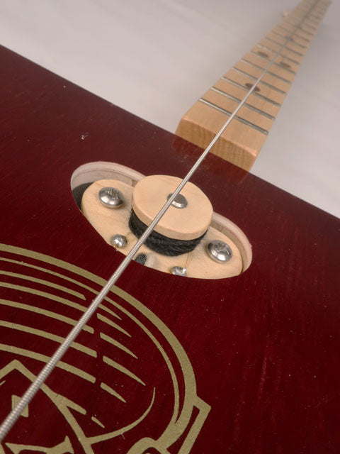 Front close up view of a one string diddly bow pick up cigar box guitar made with a Fat Bottom Betty cigar box. Handmade by Mike Snowden of Snowden Guitars.