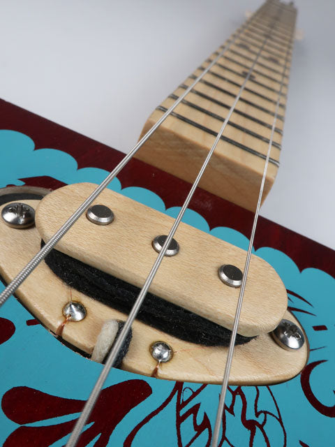 Close up view of a 3 string cigar box guitar single coil pickup made from maple wood. This pickup is handmade by Mike Snowden of Snowden Guitars.