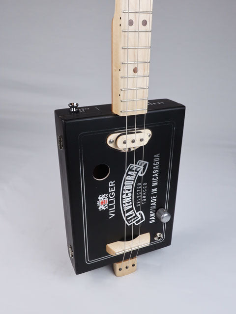 Front view of a 3 string cigar box guitar with a maple single coil pickup. Villigaer La Vencedora logo printed in silver on a black cigar box. This cigar box guitar is handmade by Mike Snowden.